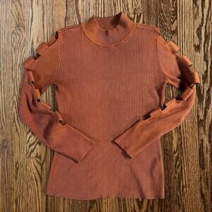Rust orange ribbed knit top